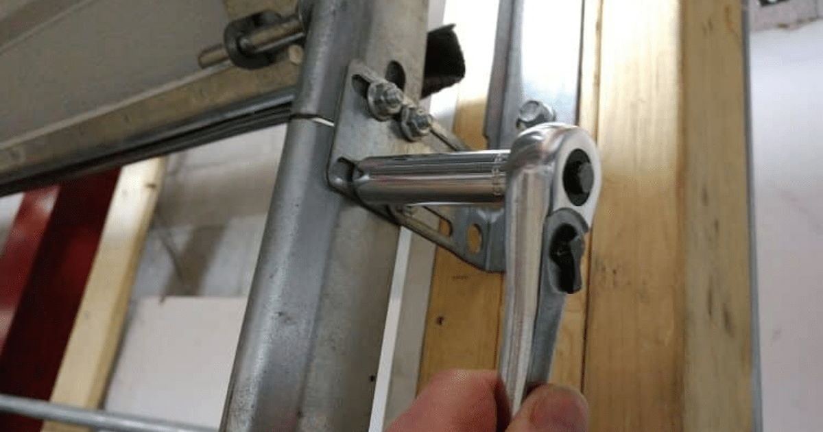 how to get a garage door wheel back on track